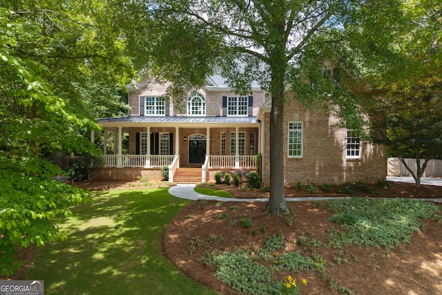 1650 Harvest Ln, Alpharetta, GA 30004 - view of front of home with a porch, brick siding, and a standing seam roof
