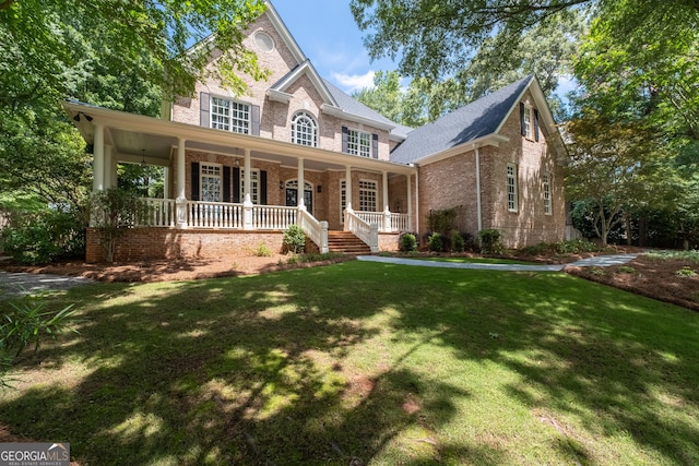 1650 Harvest Ln, Alpharetta, GA 30004 - view of front of house featuring brick siding, a porch, and a front lawn