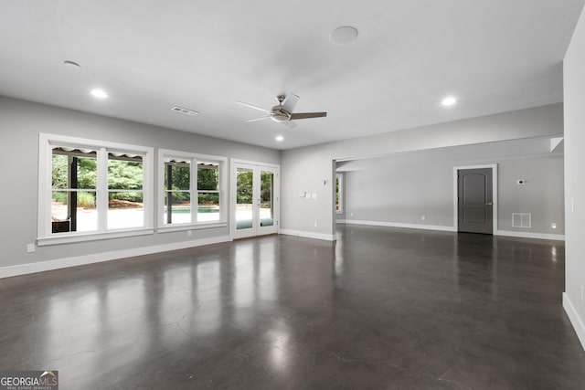 1650 Harvest Ln, Alpharetta, GA 30004 - unfurnished living room with ceiling fan, plenty of natural light, finished concrete flooring, and recessed lighting