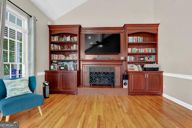 1875 Edgemont Ct, Cumming, GA 30041 - living area featuring a premium fireplace, light wood-style flooring, and lofted ceiling