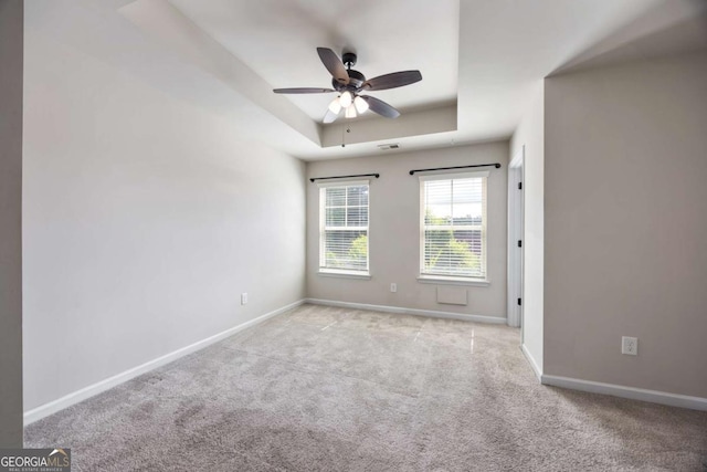 1005 Bayrose Cir Unit 5A, Atlanta, GA 30344 - carpeted spare room with a raised ceiling and a ceiling fan