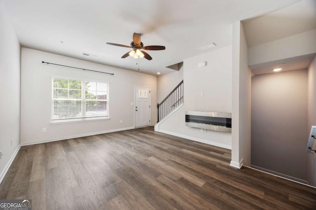 1005 Bayrose Cir Unit 5A, Atlanta, GA 30344 - unfurnished living room with a ceiling fan, dark wood-style floors, stairway, and recessed lighting