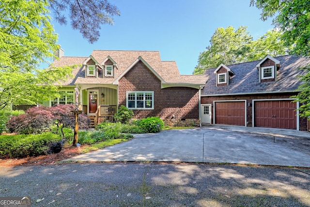 249 Dalton Dr, Dillard, GA 30537 - view of front of house featuring concrete driveway, a chimney, board and batten siding, and an attached garage