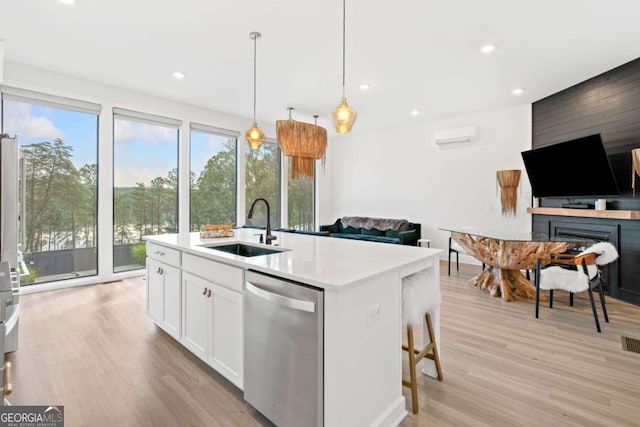 103 Marina Parc Dr, Waleska, GA 30183 - kitchen featuring stainless steel dishwasher, light wood-type flooring, open floor plan, white cabinets, and light countertops