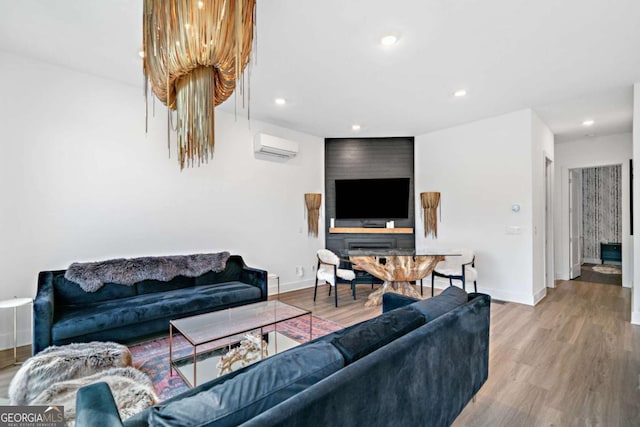 103 Marina Parc Dr, Waleska, GA 30183 - living area with wood finished floors, a wall mounted AC, and recessed lighting