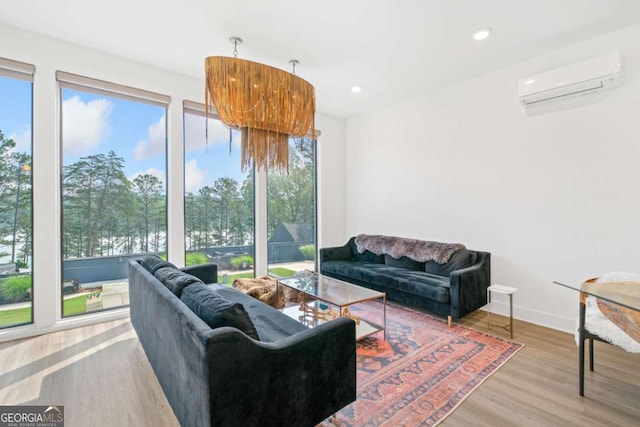 103 Marina Parc Dr, Waleska, GA 30183 - living room featuring a wall mounted AC, plenty of natural light, wood finished floors, and recessed lighting