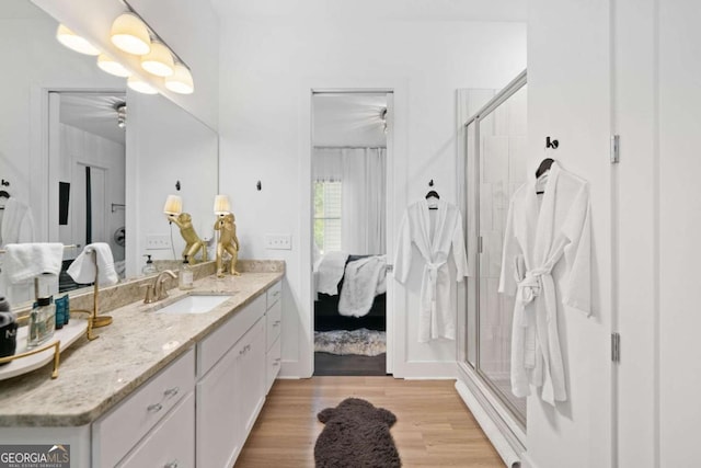 103 Marina Parc Dr, Waleska, GA 30183 - bathroom featuring connected bathroom, vanity, a stall shower, ceiling fan, and wood finished floors