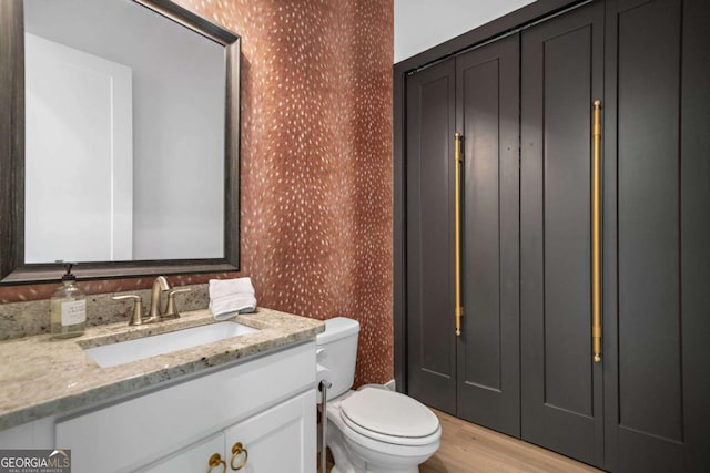 103 Marina Parc Dr, Waleska, GA 30183 - bathroom with wallpapered walls, vanity, and wood finished floors