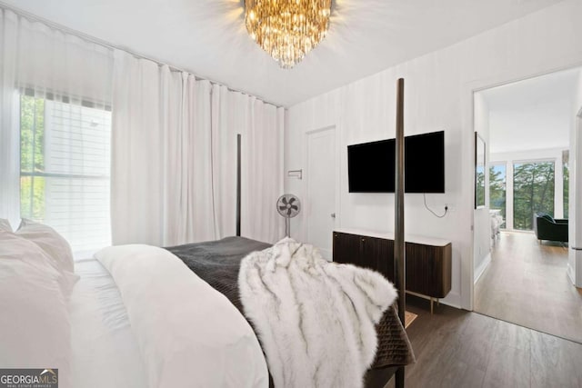 103 Marina Parc Dr, Waleska, GA 30183 - bedroom featuring a chandelier and dark wood-type flooring