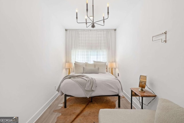103 Marina Parc Dr, Waleska, GA 30183 - bedroom with a chandelier and wood finished floors