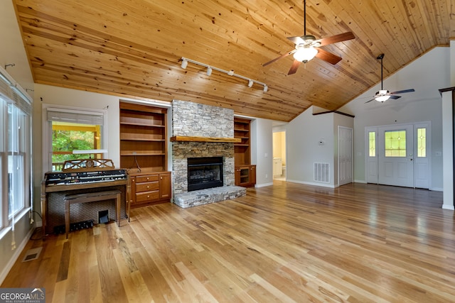 55 Cool Spring Ln, Clayton, GA 30525 - living area with rail lighting, light wood-style flooring, a ceiling fan, wood ceiling, and healthy amount of natural light