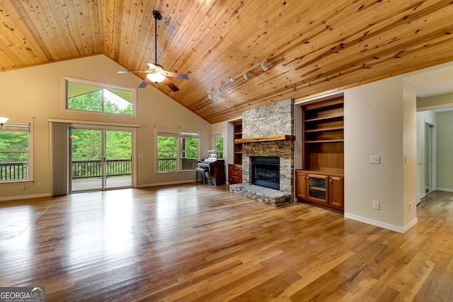 55 Cool Spring Ln, Clayton, GA 30525 - unfurnished living room featuring ceiling fan, a fireplace, built in features, light wood-style flooring, and wooden ceiling