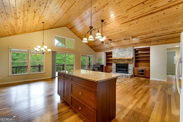 55 Cool Spring Ln, Clayton, GA 30525 - kitchen featuring a chandelier, wood ceiling, open floor plan, a stone fireplace, and light wood-style flooring