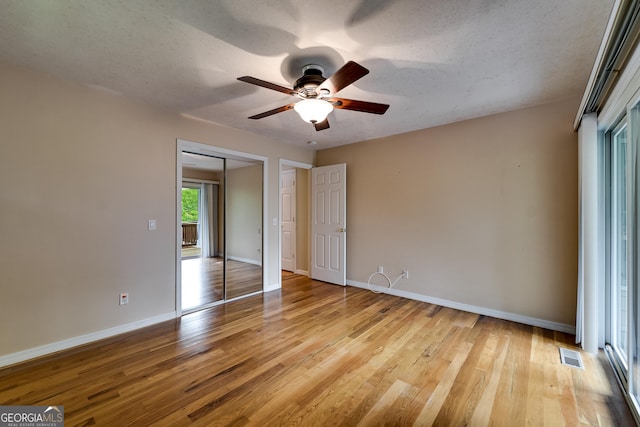 55 Cool Spring Ln, Clayton, GA 30525 - unfurnished bedroom featuring wood finished floors, a closet, and a ceiling fan