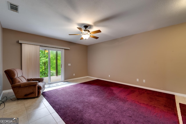 55 Cool Spring Ln, Clayton, GA 30525 - unfurnished living room featuring ceiling fan, light tile patterned floors, and light carpet
