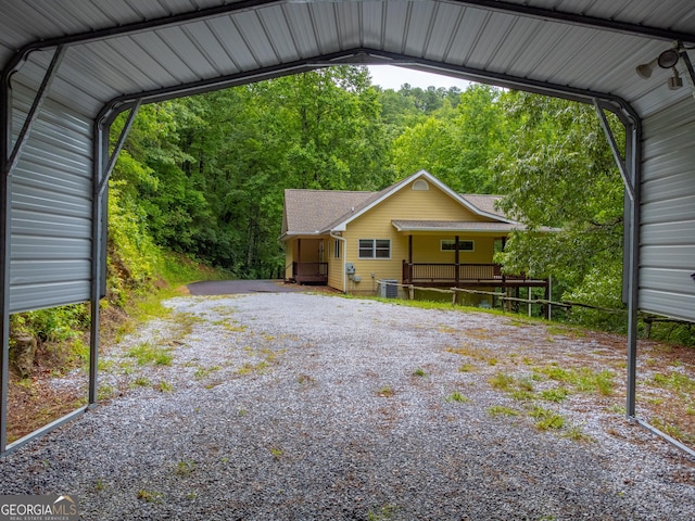 55 Cool Spring Ln, Clayton, GA 30525 - view of car parking featuring a view of trees and a detached carport