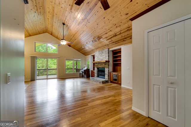 55 Cool Spring Ln, Clayton, GA 30525 - unfurnished living room with ceiling fan, wooden ceiling, a fireplace, built in shelves, and light wood finished floors