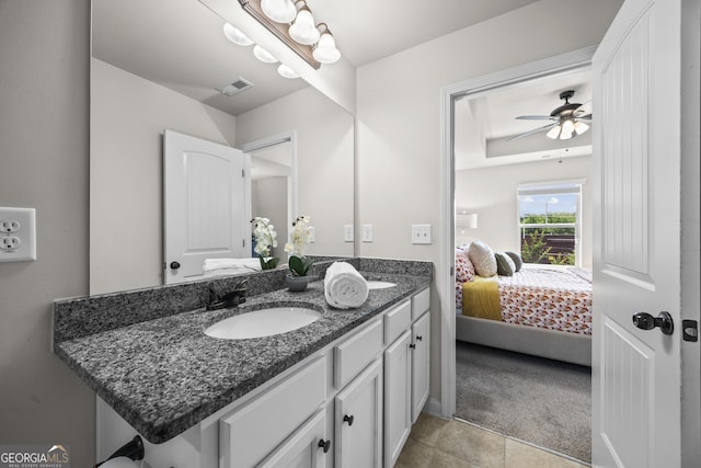 1004 Bayrose Cir, East Point, GA 30344 - ensuite bathroom with double vanity, a ceiling fan, and tile patterned flooring