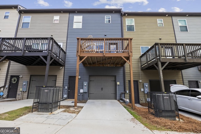 1004 Bayrose Cir, East Point, GA 30344 - back of house with a garage, driveway, and a wooden deck