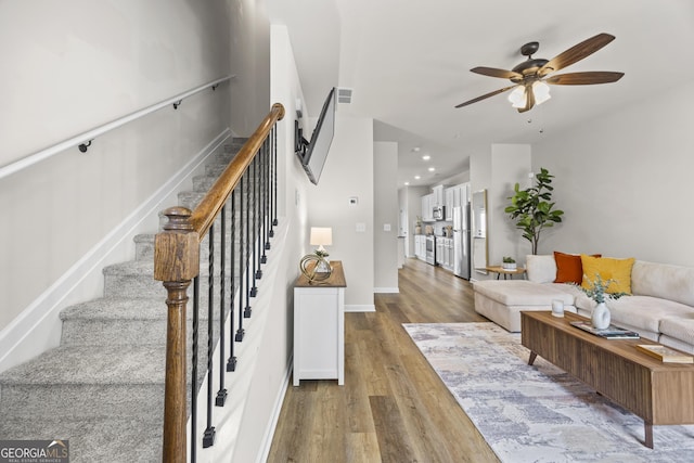 1004 Bayrose Cir, East Point, GA 30344 - living room with a ceiling fan, wood finished floors, stairway, and recessed lighting