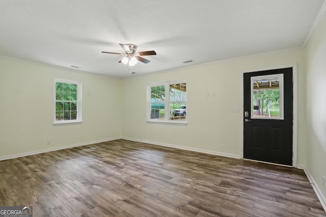 1469 Tabernacle Church Rd, Lincolnton, GA 30817 - foyer entrance featuring plenty of natural light, a ceiling fan, dark wood-type flooring, and crown molding