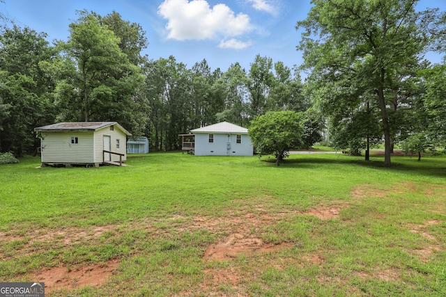 1469 Tabernacle Church Rd, Lincolnton, GA 30817 - view of grassy yard with a storage shed