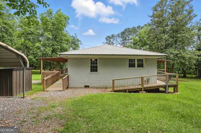1469 Tabernacle Church Rd, Lincolnton, GA 30817 - rear view of house featuring a lawn, a metal roof, and a wooden deck