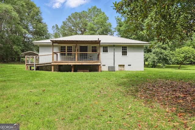 1469 Tabernacle Church Rd, Lincolnton, GA 30817 - rear view of house with a yard, a wooden deck, and a metal roof