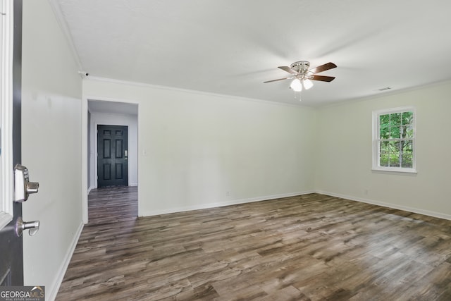 1469 Tabernacle Church Rd, Lincolnton, GA 30817 - spare room featuring a ceiling fan, dark wood-type flooring, and ornamental molding