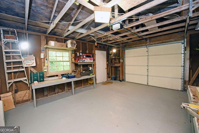 780 Watson Gap Rd, Mineral Bluff, GA 30559 - garage featuring a garage door opener and a workshop area