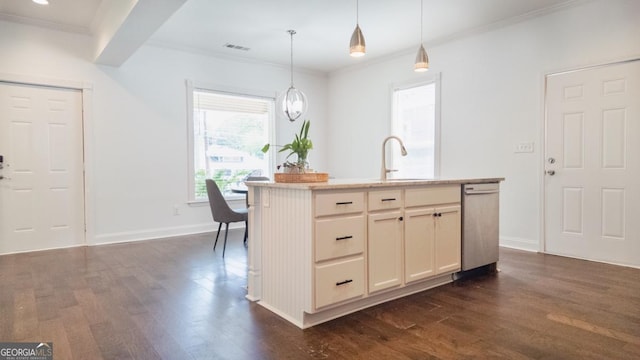 996 Palmetto Ave SW, Atlanta, GA 30314 - kitchen with dark wood finished floors, stainless steel dishwasher, light countertops, ornamental molding, and pendant lighting