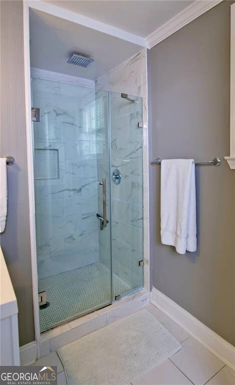 996 Palmetto Ave SW, Atlanta, GA 30314 - full bathroom with a marble finish shower, vanity, and ornamental molding
