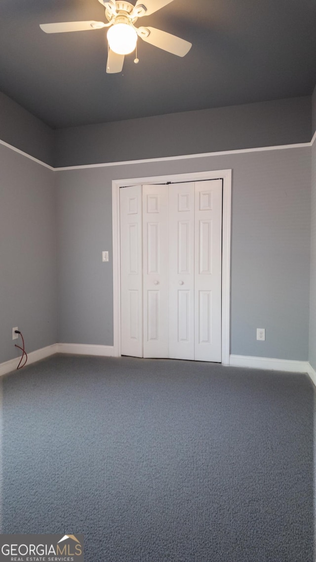 996 Palmetto Ave SW, Atlanta, GA 30314 - unfurnished bedroom with carpet flooring, a ceiling fan, and a closet