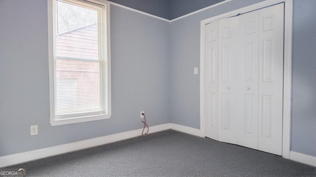 996 Palmetto Ave SW, Atlanta, GA 30314 - unfurnished bedroom with dark carpet and a closet