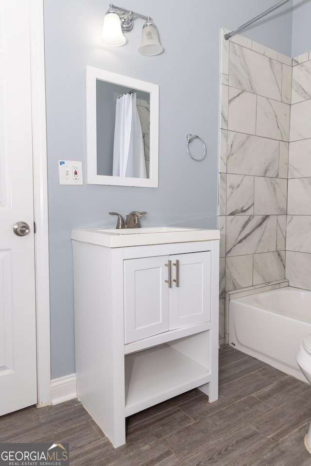 996 Palmetto Ave SW, Atlanta, GA 30314 - bathroom with vanity, wood finished floors, and shower / tub combo