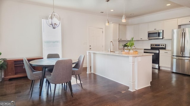 996 Palmetto Ave SW, Atlanta, GA 30314 - dining room featuring dark wood finished floors, recessed lighting, and crown molding
