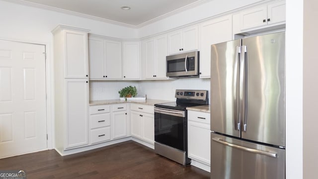 996 Palmetto Ave SW, Atlanta, GA 30314 - kitchen featuring stainless steel appliances, white cabinetry, dark wood finished floors, ornamental molding, and recessed lighting