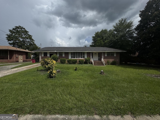 3109 Imperial Dr, Macon, GA 31211 - ranch-style home featuring brick siding, driveway, and a front lawn