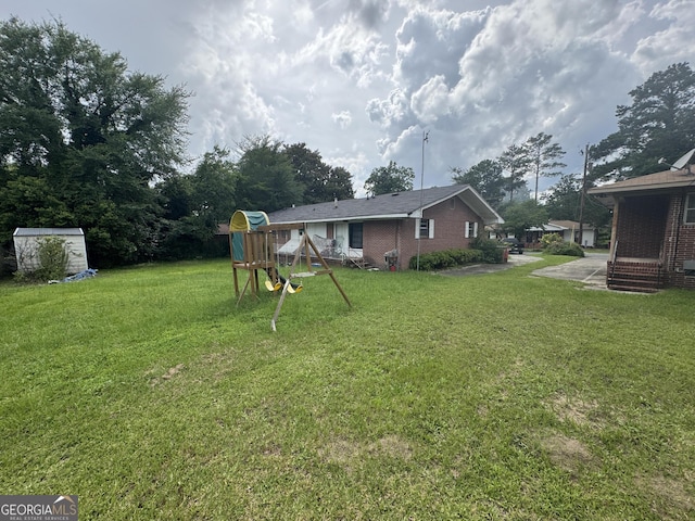 3109 Imperial Dr, Macon, GA 31211 - view of green lawn featuring a playground
