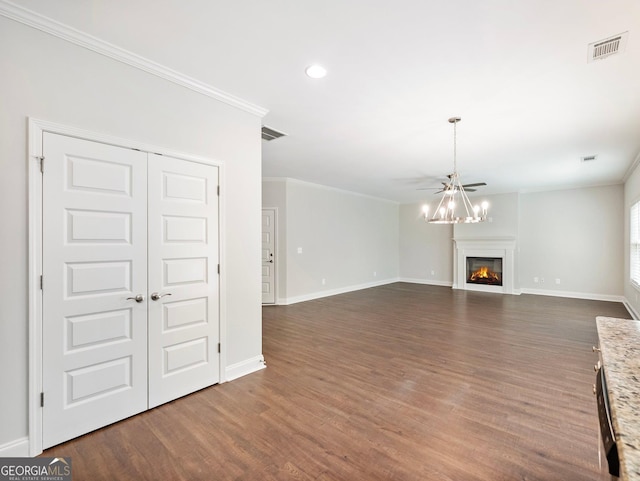 9701 Davis St, Braselton, GA 30517 - unfurnished living room with ornamental molding, dark wood-type flooring, a glass covered fireplace, recessed lighting, and a ceiling fan