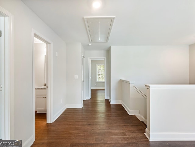 9701 Davis St, Braselton, GA 30517 - hall with attic access, dark wood-style floors, and an upstairs landing