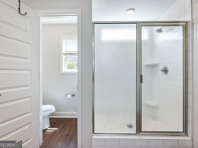 9701 Davis St, Braselton, GA 30517 - bathroom with a stall shower and wood finished floors
