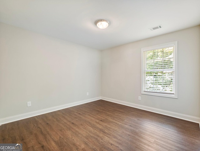 9701 Davis St, Braselton, GA 30517 - empty room with dark wood-style floors and baseboards