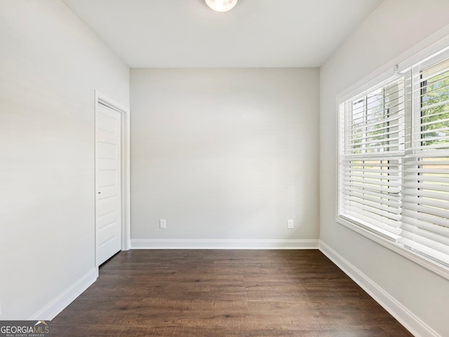 9701 Davis St, Braselton, GA 30517 - empty room with dark wood-style floors and baseboards