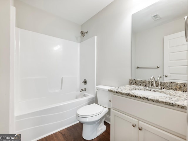 9701 Davis St, Braselton, GA 30517 - full bath with vanity, wood finished floors, and shower / washtub combination