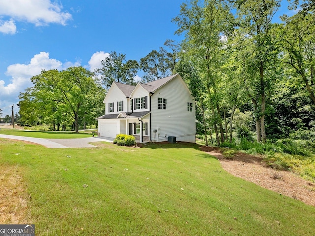 9701 Davis St, Braselton, GA 30517 - view of front of house with an attached garage, concrete driveway, and a front lawn
