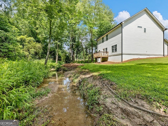 9701 Davis St, Braselton, GA 30517 - view of side of home with a lawn and a deck