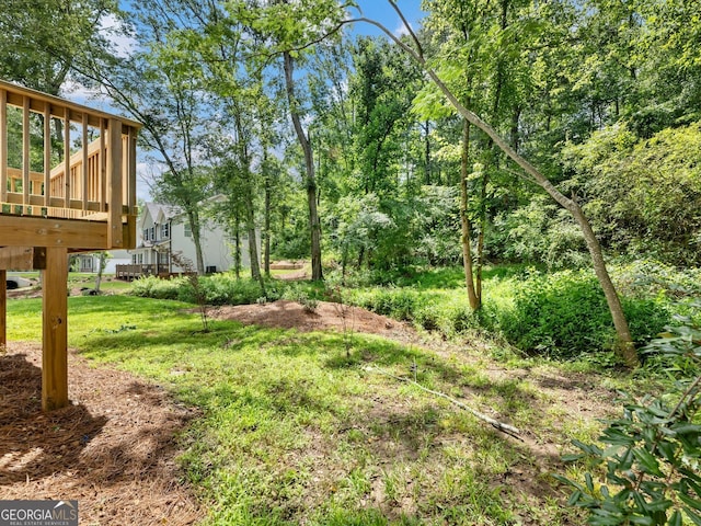 9701 Davis St, Braselton, GA 30517 - view of grassy yard featuring a wooden deck