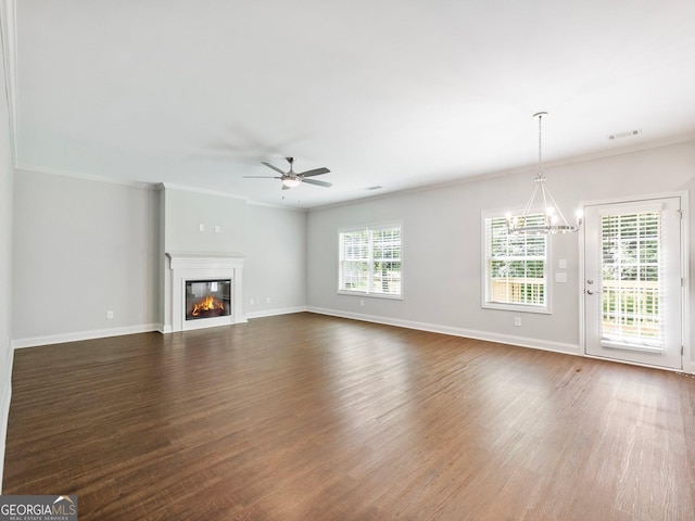 9701 Davis St, Braselton, GA 30517 - unfurnished living room with healthy amount of natural light, ceiling fan, dark wood-type flooring, and ornamental molding