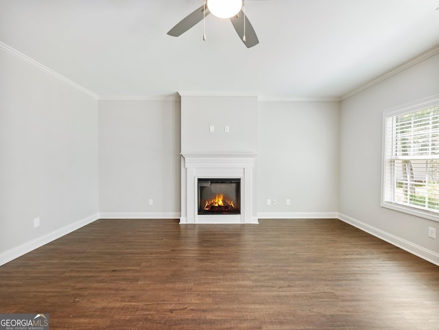 9701 Davis St, Braselton, GA 30517 - unfurnished living room featuring a glass covered fireplace, a ceiling fan, dark wood-style floors, and crown molding